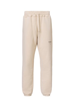 Beige drawstring sweatpants with elastic ankles and a small "ALLSAINTS" logo on the upper thigh, shown against a white background.