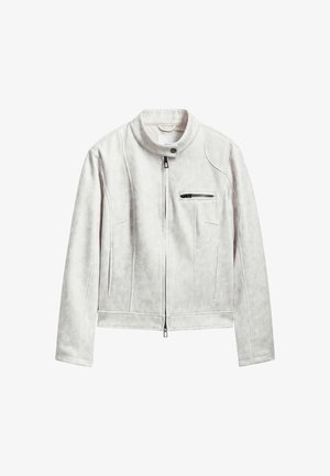 Helehall faux suede jakk, millel on seisva krae, ees lukuga ning lukuga rinna-tasku. Iseloomustab quiltitud tekstuur ja kitsas siluett.