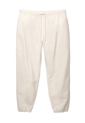 Light beige cotton pants with an elastic waistband, drawstring, and tapered cuffs; features side pockets and a soft, textured finish.