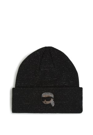 Bonnet en tricot noir avec fils métalliques argentés, conçu avec un revers, arborant un patch logo circulaire avec une illustration d'une figure portant des lunettes de soleil.