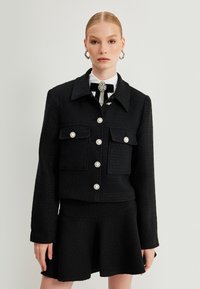 Koton Lichte jas - black