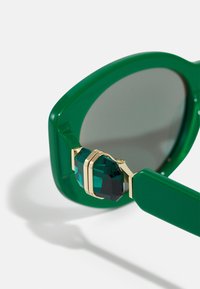Swarovski Saulesbrilles - green