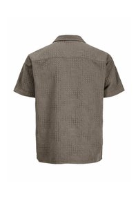Chemise grise à manches courtes avec motifs abstraits texturés, col classique et ourlet droit, vue de dos.