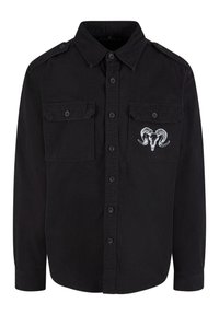 Black button-up shirt with two chest pockets, shoulder epaulettes, and a white ram skull graphic on the left pocket. Cotton fabric.