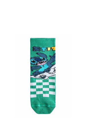 Green socks featuring a character design, white and green checkered pattern at the bottom, and the word "STITCH" in bold yellow and blue.