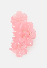 Garras de cabelo em plástico rosa, com grandes padrões florais e centros recortados, superfície lisa e acentos curvos para uma melhor aderência.
