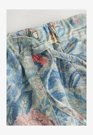 Blue fabric pants with pink and blue floral pattern, featuring an elastic waistband and tied drawstring at the front.