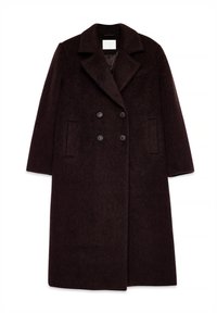 Dvigubo užsegimo rudas vilnonis paltas su plačiu apykakle, tekstūruotu audiniu ir dviem šoninėmis kišenėmis. Yra juodos sagos ir ilga siluetas.