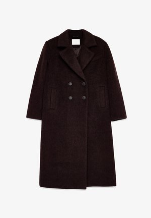 Dubbelzijdige bruine wollen jas met een brede kraag, textuurstof en twee zijzakken. Voorzien van zwarte knopen en een lange silhouet.
