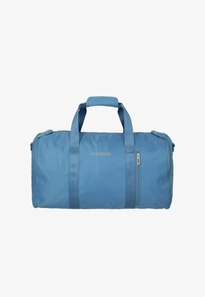 Borsa da viaggio Travelite azzurro chiaro con due manici e una piccola tasca con cerniera frontale su sfondo bianco.