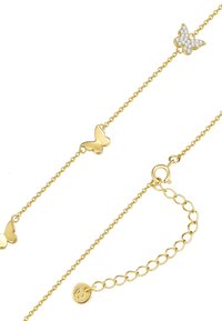 Zlatna zapestnica z metuljčki, ki vsebuje tri metuljčke, od katerih je en okrašen s prozornimi rhinestones, povezani z nežno verigo s sponko na ježka.