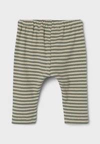 Colanți pentru bebeluși, cu dungi verzi și crem, realizați dintr-un material ribbed. Talie elastică și picioare conice, cu o decupare la nivelul între anii.