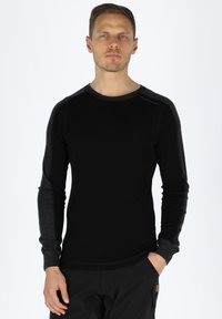 Black long-sleeve shirt with dark gray accents. Soft texture, round neckline, and fitted design. Logo near shoulder. Plain background.