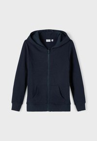 Sweat à capuche zippé bleu marine foncé avec une capuche doublée, des poches avant et des poignets côtelés. Fabriqué en tissu doux et extensible avec une texture lisse.