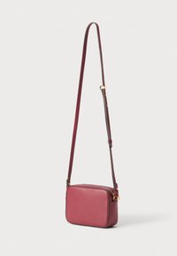 Burgundy leather crossbody bag with a rectangular shape, adjustable strap, gold hardware, and textured surface. Zippered top closure.