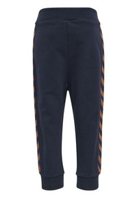 Navy Sweatpants mit einem gerippten Bund und Knöchelbündchen, die diagonale Streifen in Braun entlang der Seitennähte aufweisen. Weicher Stoff.
