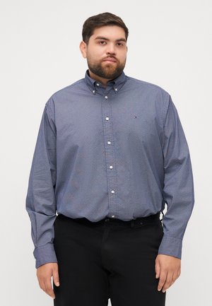 Mörkblå knapp-up skjorta med ett geometriskt mönster, långa ärmar och krage. Tyget verkar slätt med en subtil lyster.