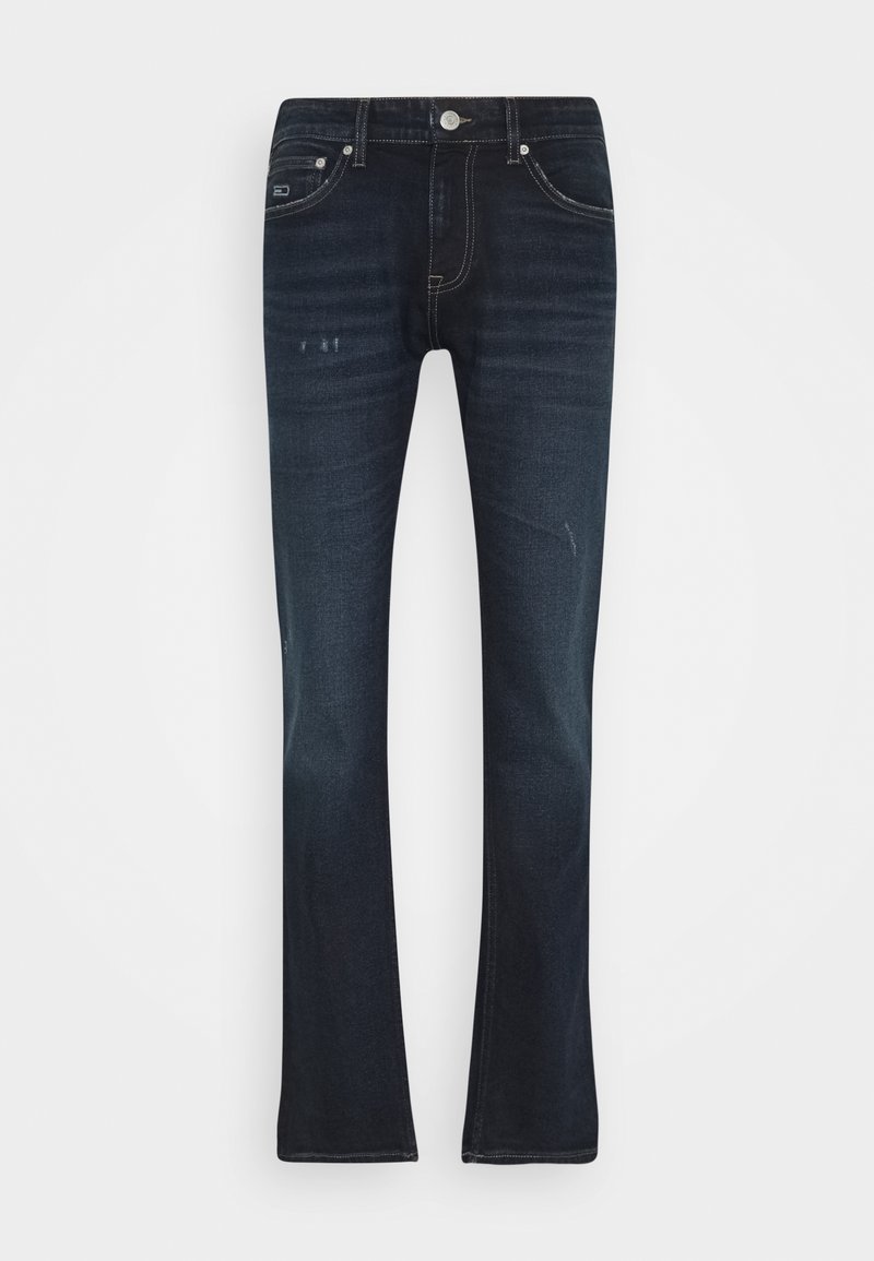 Tmavě modré džíny z džínoviny s rozšířeným střihem nohavic, pěti kapsami, kontrastním bílým prošitím a mírnými známkami opotřebení v oblasti kolen.