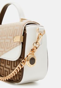 Small handbag featuring a geometric pattern in beige and brown, white leather accents, and a gold-tone chain strap with a logo charm.