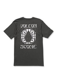 Sort bomulds t-shirt med et stort hvidt grafisk print på ryggen, der har et dråbe- og gitterdesign, mærket "VOLCOM STONE."