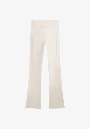 Pantalons évasés en crème, fabriqués en tissu doux. Dotés d'une taille haute et de détails de fermeture éclair sur les coutures. Texture lisse et uniforme.