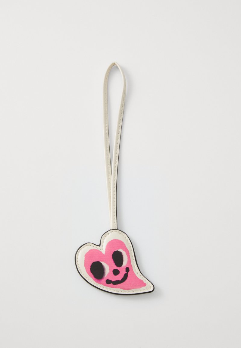 Pink and black ghost-shaped keychain with a white outline and a leather-like strap, featuring a smiling face design.
