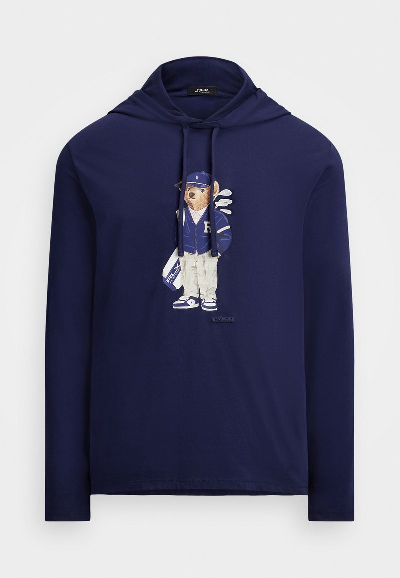 Tumesinine pikka varrukat hoodie, millel on karu graafika spordivariandis, kanda müts, jakk ja golfikepid. Valmistatud pehmest kangast, klassikaline lõige.