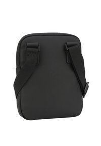 Borsa a tracolla nera con finitura liscia e opaca, dotata di spallacci regolabili e forma rettangolare. Design minimalista senza loghi visibili.