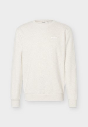 Vaalean beigen värinen pyöreäkauluksinen collegepaita, jossa pitkät hihat ja vasemmassa rinnassa "BORG"-logo, resorit kalvosimissa ja helma.