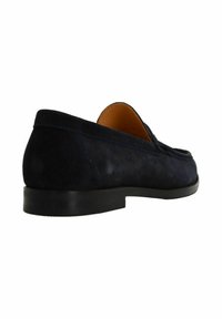 Navy suede loafer with a smooth texture, low-profile black rubber sole, and minimalist design, featuring a rounded toe and subtle stitching.