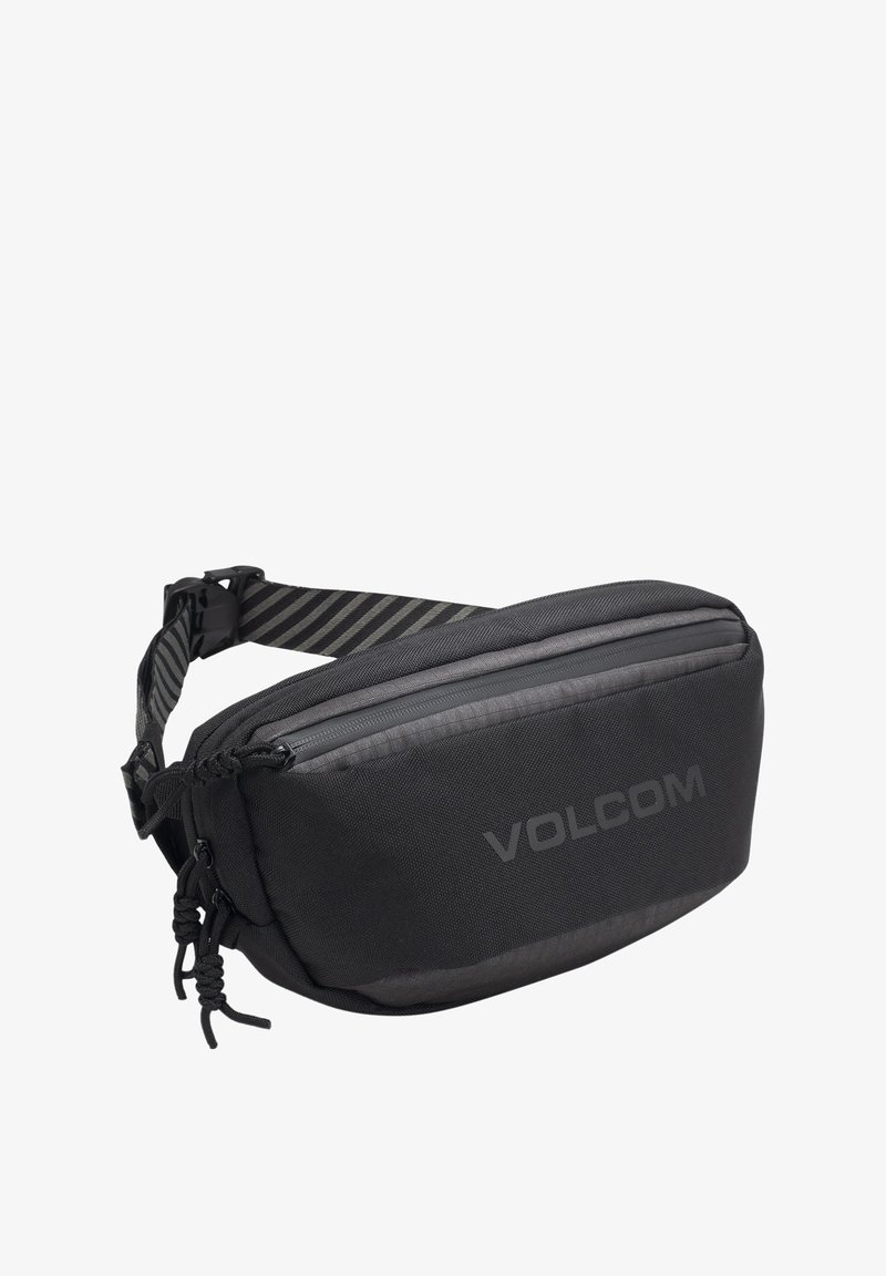 Borsa a vita nera realizzata in tessuto strutturato. Dotata di una tasca frontale con zip, di una tracolla regolabile a strisce e del logo Volcom sul lato.