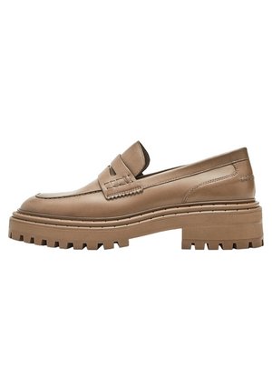 Tan leather loafer with chunky treaded sole and raised heel, featuring a stitched strap across the upper and detailed stitching along edges.