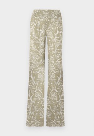 Udstoppede bukser i lysegrøn stof med et hvidt blomsterprint. Har en elastisk talje og en struktureret overflade.