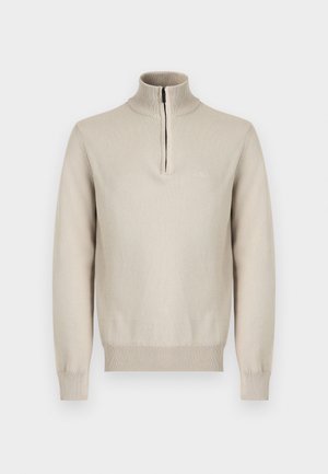 Béžový dlhý rukáv pletený sveter s polozipsom, rebrovaným vysokým golierom a rebrovanými manžetami a lemom.