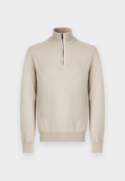 Beež pikkade varrukatega kootud kampsun poollukuga soonikkoega kõrge kraega ning soonikkoega varruka sääred ja alumine äär.