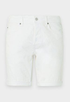 Valged teksapüksid, millel on nööbi- ja tõmblukuga sulgemine, vööaasad, ees taskud ja üleskeeratud ääred.