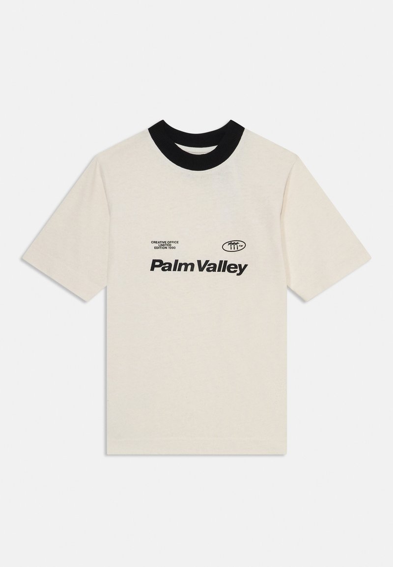 Short-sleeve beige cotton t-shirt with a black ribbed collar and black printed text reading "Palm Valley" on the front.