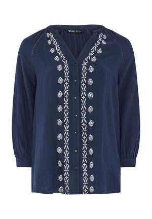 Mørkeblå bluse med lange ærmer og V-hals. Udsmykket med hvid blomsterbroderi foran og knaplukning. Tekstureret stof.
