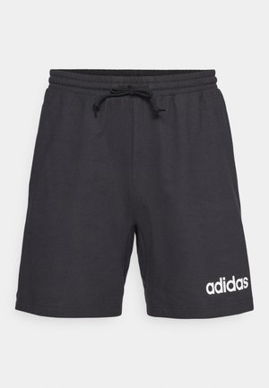 Calções pretos de algodão com cintura elástica, cordão de ajuste e logótipo branco da adidas no canto inferior esquerdo. Textura suave, design até ao joelho.