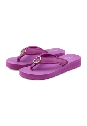 Purple flip-flops with a flat sole, featuring double straps and circular metallic accents. Made of rubber with a smooth texture.