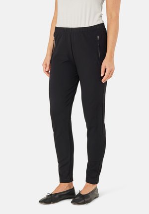 Zwarte sportbroek met een aansluitende pasvorm, elastische tailleband en zijzakken met rits. Gemaakt van een gladde, rekbare stof.