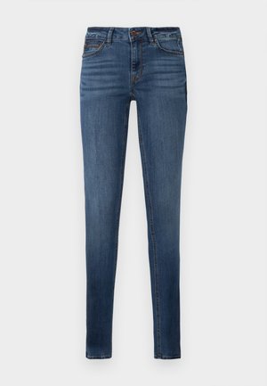 Jeans de denim skinny-fit azuis com ligeira descoloração, fecho de correr à frente, botão de fecho e cinco bolsos.