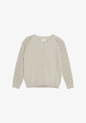 Jasnobeżowy kardigan wykonany z dzianiny. Posiada rękawy w wzór koronkowy, zapięcie na guziki i falbaniasty dół.