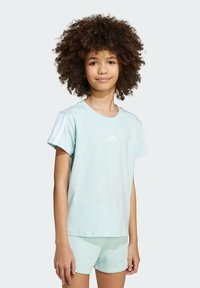 Light blue cotton t-shirt featuring short sleeves with white stripes, a small logo on the chest, paired with matching shorts.