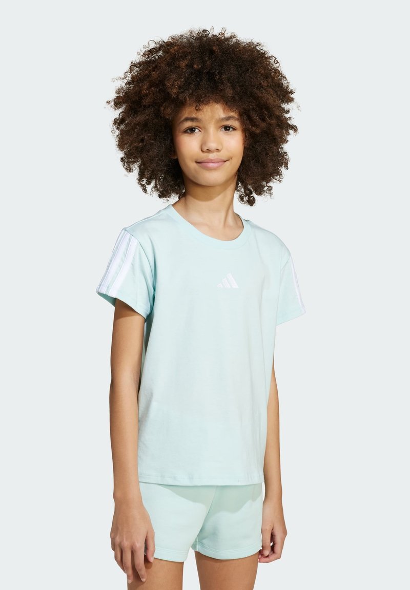 Light blue cotton t-shirt featuring short sleeves with white stripes, a small logo on the chest, paired with matching shorts.