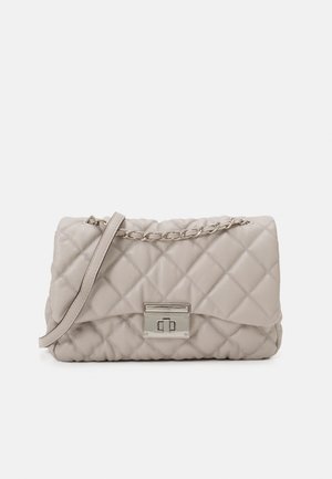 Quilted light beige leather handbag with silver chain and leather strap, rectangular silver turn-lock closure on front flap.