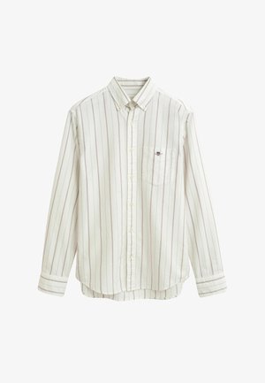 Chemise blanche à boutons avec des rayures verticales rouges, une poche poitrine et un col pointu. Fabriquée en coton léger.