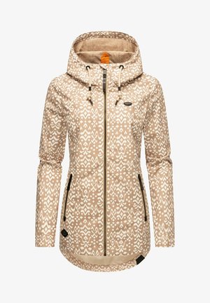Beige huppari, jossa on valkoinen geometrinen kuvio, edessä vetoketju, kaksi sivutaskua ja säädettävät nyörit. Pehmeä rakenne.
