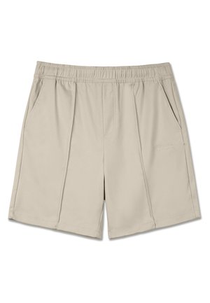 Beige shorts lavet af et glat, let stof. Har en elastisk talje og to sidelommer med fine stikninger.