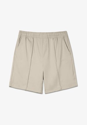 Beige shorts laget av et glatt, lett stoff. Har en elastisk midje og to sidelommer med delikate sømdetaljer.